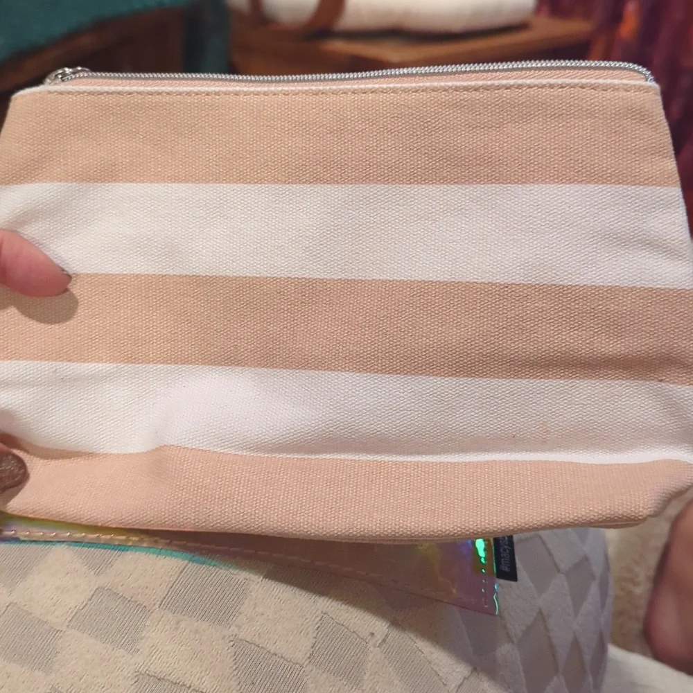 Cosmetic Bag Cases. Two. One Is Pink And White. One Is Shiny Pink.
